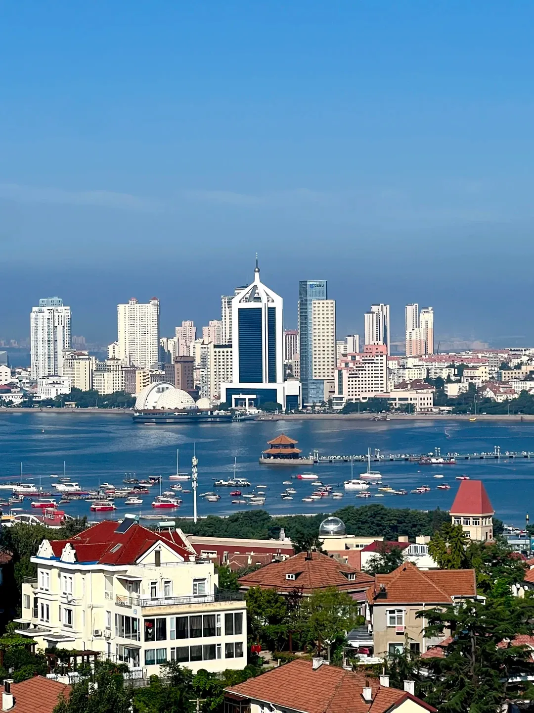 Qingdao coastline with red-tiled roofs and the sea